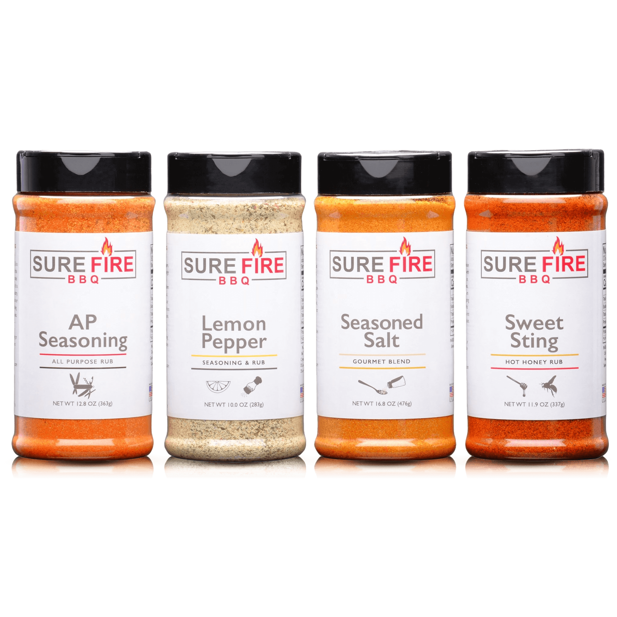 Sure Fire BBQ Essentials Pack featuring four bottles: AP Seasoning, Lemon Pepper, Seasoned Salt, and Sweet Sting Hot Honey Rub. Each bottle is arranged side by side, showcasing a variety of flavors designed to enhance everyday cooking and grilling. This pack includes versatile blends for all levels of culinary experience.