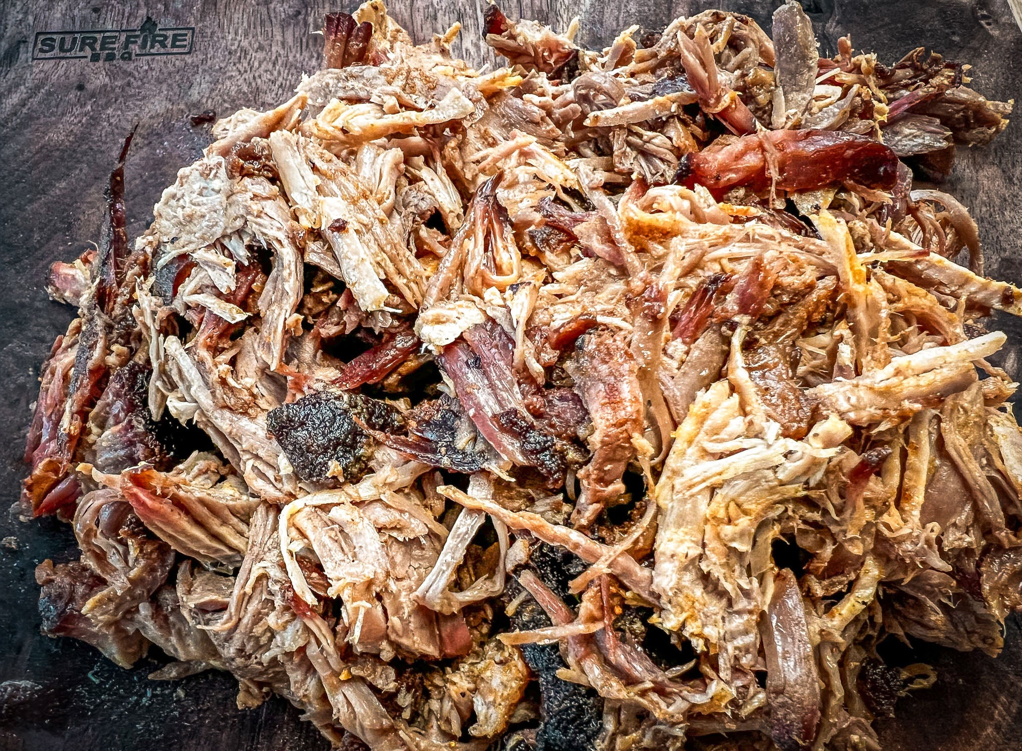 Finished pork butt shredded and ready to serve